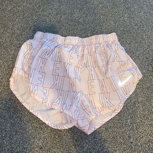 Nike Retro-Style Athletic Shorts in Light Pink and White